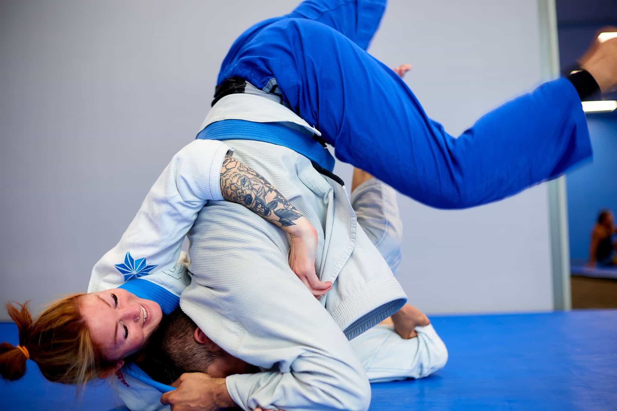 Two members locked in a hold on the mat